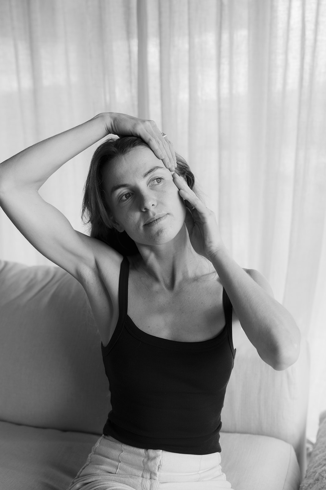 A woman practicing a guided facial movement